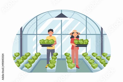 Two people tending to seedlings inside a modern greenhouse structure