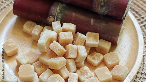 Brown sugar with fresh sugar cane