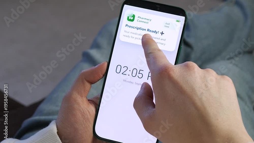 Close-up of a person receiving a pharmacy pickup alert on their phone. Modern digital healthcare concept showing medication readiness. Perfect for health tech commercials, telemedicine ads, and