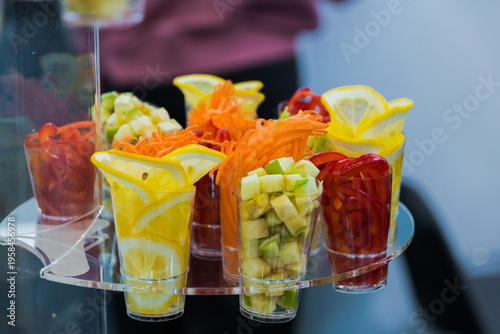 fresh fruit and vegetable slices in cups