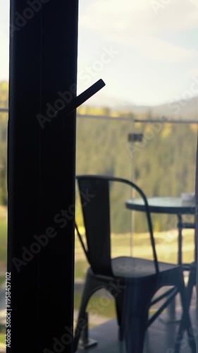 Chill and relax in a hotel room with a balcony and mountain views. A beautiful, quiet, and peaceful natural atmosphere for a vacation or retreat. A journey to recharge.