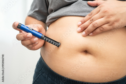 Photos Asian woman injecting herself diabetes injecting insulin in stomach at home