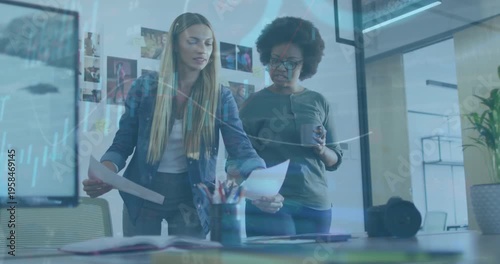 Animation of financial data processing over diverse businesswomen in office