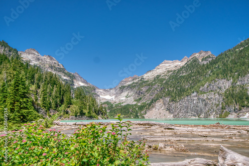Clear blue sky above jagged mountain peaks