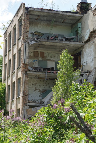 Photography Ruined Facade of an Abandoned Multi-Story Building in Pripyat with Exposed Inter