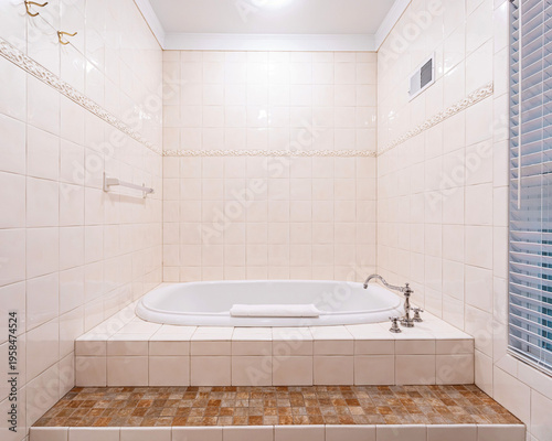 Bild auf Leinwand Traditional tiled bathroom interior with built in soaking tub, cream wall tile a
