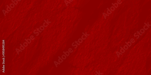 Deep red textured wall background with organic rough plaster surface and soft shadows