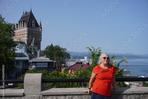 Senior woman in front of the Frontenac Castle in Quebec