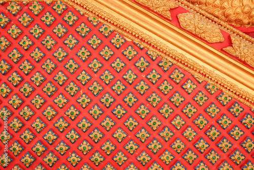 Schilderij op canvas Traditional Thai Pattern Background with Golden Ornaments on Red Wall