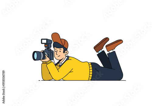 Photographer lying on the floor taking photo with camera