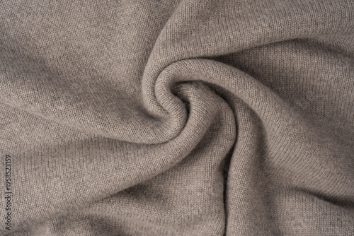 Soft grey merino wool sweater texture as a background.