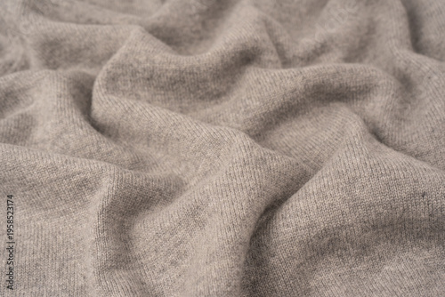 Soft grey merino wool sweater texture as a background.