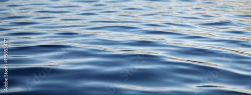Beautiful abstract background of blue water surface created by natural light and ripples
