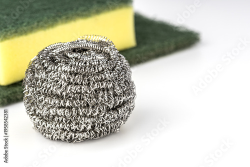 Stainless Steel Wire Wool Scrubber Ball and Yellow Green Kitchen Sponge Cleaning Pad Isolated on Clean White Background for Household Dishwashing Use