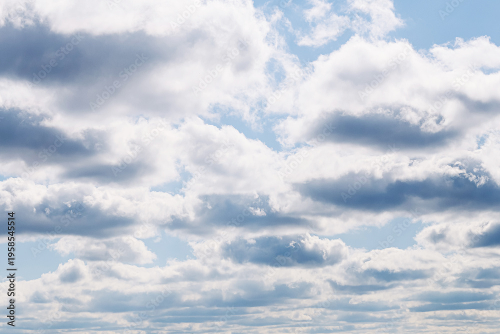 Obraz premium Blue sky with scattered clouds. Weather concept. Natural atmosphere background. Open air environment. Calm outdoor scene for climate seasonal design and travel backdrop use.