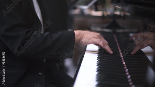 Close up of Musician's Hands in Suit Playing Grand Piano Keys