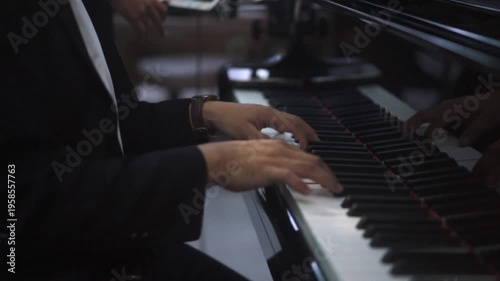 Close up of Musician's Hands in Suit Playing Grand Piano Keys