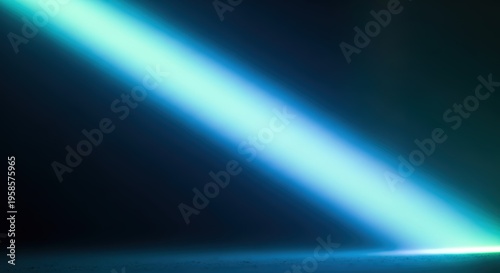 Vibrant blue-green light beam illuminating a dark, reflective surface with a dramatic diagonal glow.