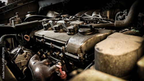 close-up view of a an old car engine with various parts. automotive background.