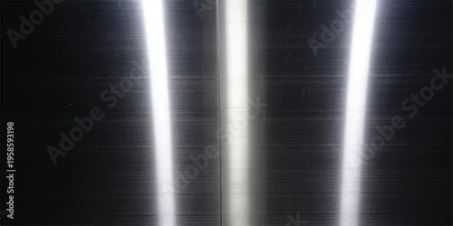 Dark metallic surface with intense vertical light streaks and subtle brushed texture with dark metal