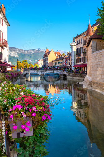 Scenic view with bridge and houses along Canal du Thiou in old town Annecy. French Alps, France