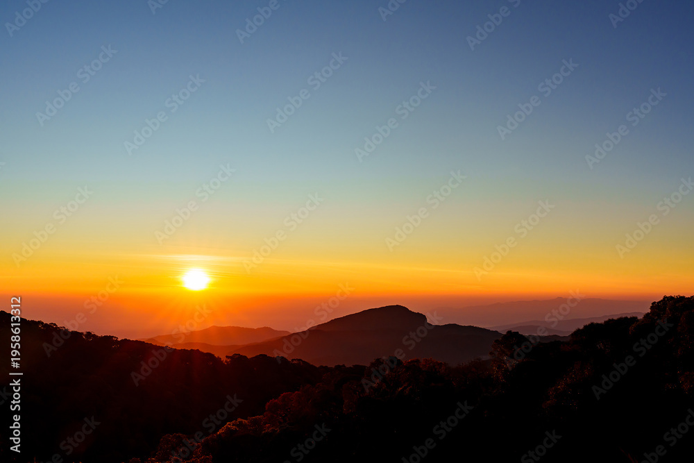Fototapeta premium Beautiful sunrise over the valleys under colorful sky in Chiang Mai, Thailand.