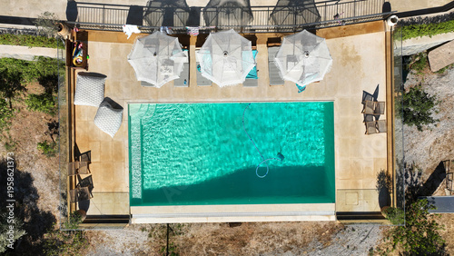 Aerial drone top view photo of luxury tropical villa with large pool located in mediterranean destination