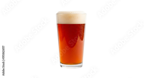 A tall glass of amber colored beer with a thick white foam head is presented isolated on a white background transparent background