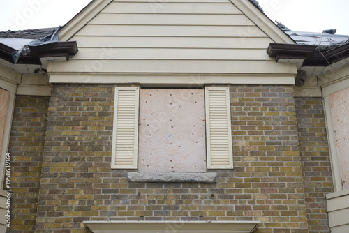 boarded up window in old building