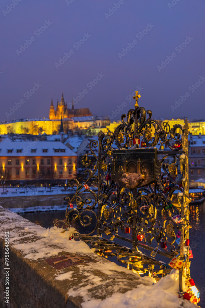 Fototapeta premium Touching holy relief on Karluv most, Prague with castle view