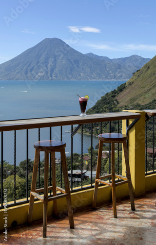 Wallpaper Mural Beverage with lime garnish set against a scenic lake atitlan and volcano backdrop, relaxation and travel lifestyle smoothie Torontodigital.ca