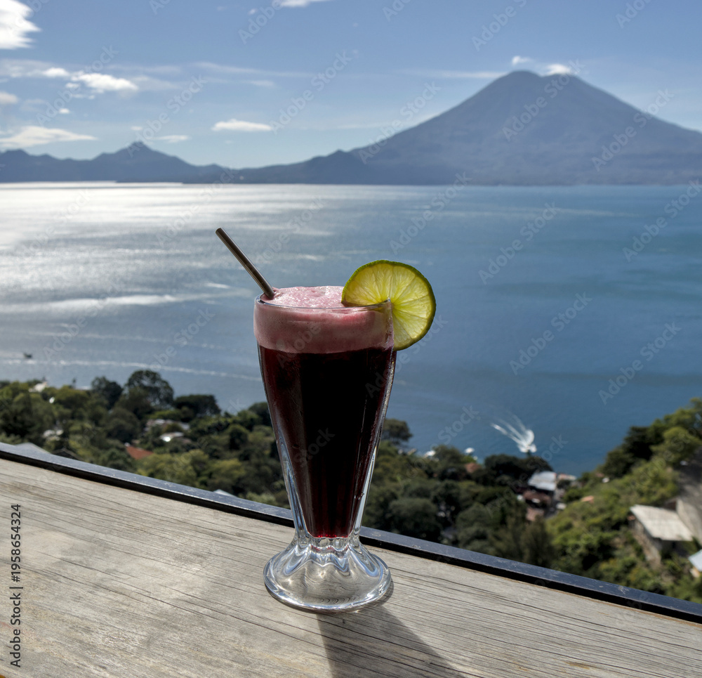 custom made wallpaper toronto digitalBeverage with lime garnish set against a scenic lake atitlan and volcano backdrop, relaxation and travel lifestyle smoothie