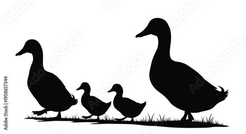 A family of ducks standing in grass depicted as a silhouette
