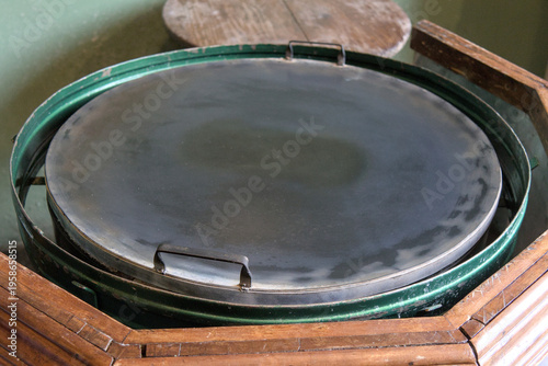 Wallpaper Mural Close-up of a traditional flat cooking griddle in a rustic kitchen setting, representing authentic local cuisine preparation and cultural heritage in a Central American home. Torontodigital.ca