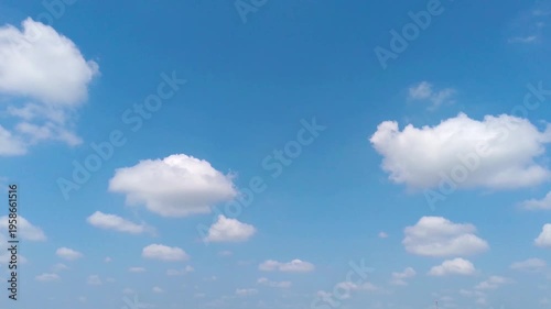 Blue Sky with White Fluffy Clouds on a Sunny Day