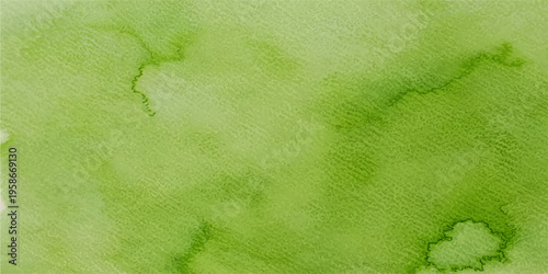 Vintage aged green paint texture with a grunge brown pattern on antique parchment paper creating an old stained wall backdrop