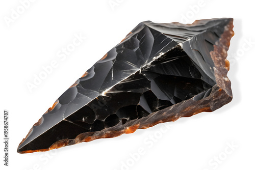 Sharp black obsidian flint arrowhead stone tool isolated on transparent background