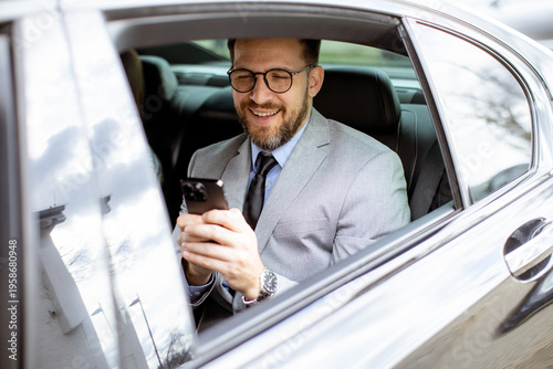 Businessman using smartphon...