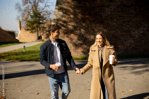 Couple walking hand in hand...