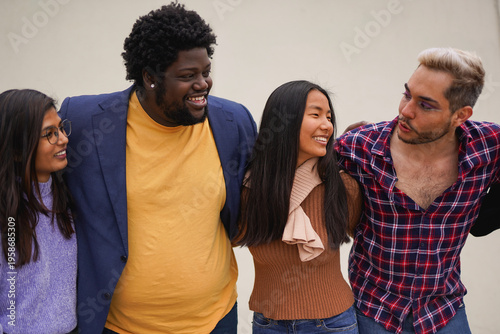 Happy multiracial friends having fun together outdoor - Young people, social inclusion and lifestyle concept