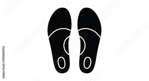 A pair of black flip flops shown from a top down perspective