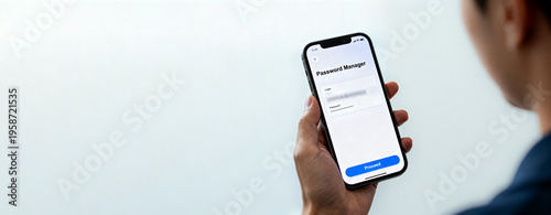 Person using a mobile password manager app on a smartphone with copy space for digital security concept