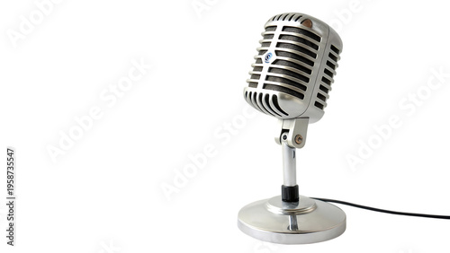 Vintage silver microphone on stand against black background