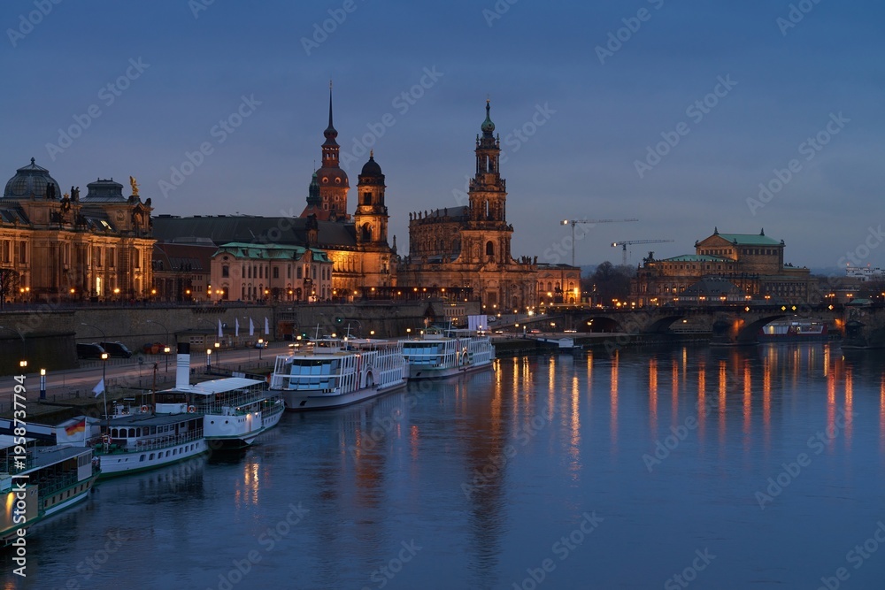Fototapeta premium Dresden panorama with Augustus Bridge and Hofkirche along Elbe River at dusk