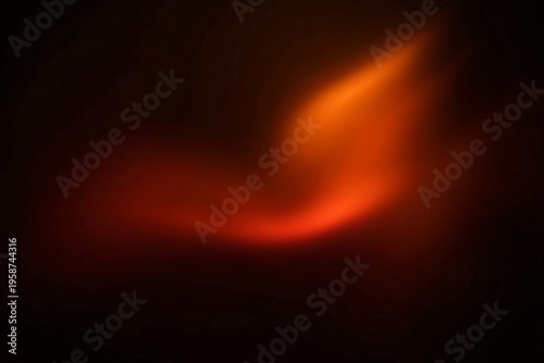 Abstract orange and red light leak on black background