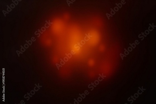 Abstract orange and red light leak on black background