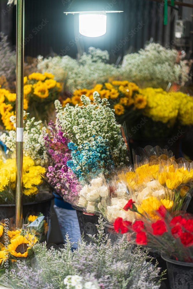 Fototapeta premium Beautiful Colorful bouquets of various flowers are presented in a flower shop in the shop for sale close up picture a city street fresh spring flowers.