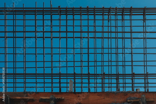 Steel Rebar Grid for Concrete Construction Against Blue Sky