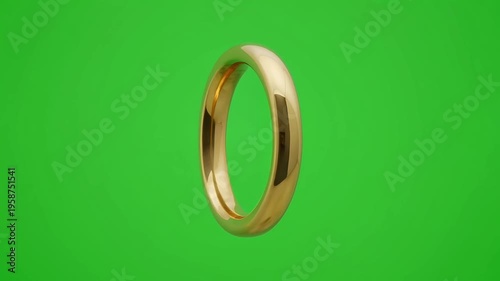 A simple gold wedding ring isolated on a green screen background, symbolizing love and commitment