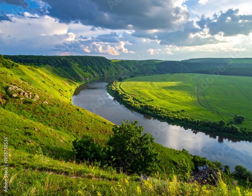 Serene valley vista featuring a river winding through lush green fields under a cloudy sky